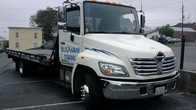 White Hino flatbed with Blue Gray lettering