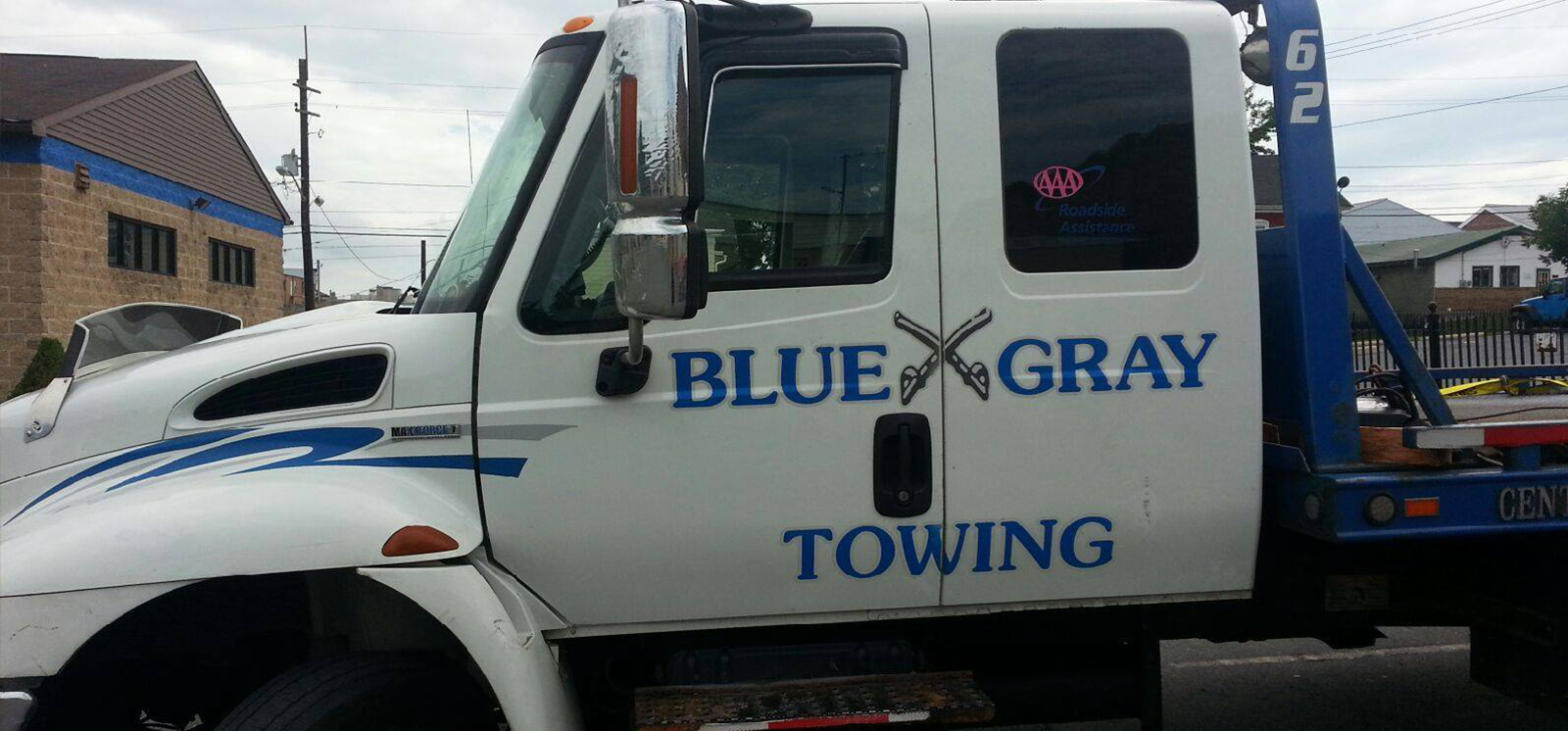 White Blue Gray Towing heavy-duty tow truck cab and boom